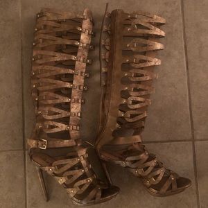 Gold gladiator heels.